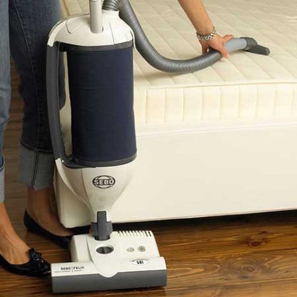 Sebo Felix Navy Eco Upright Vacuum Cleaner In Action